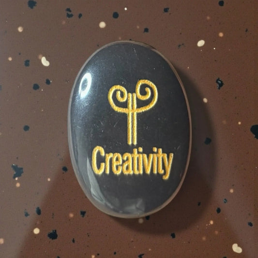 Zibu Symbol Palm Stone – Creativity Symbol Engraved on Black Tourmaline - Soulara Life