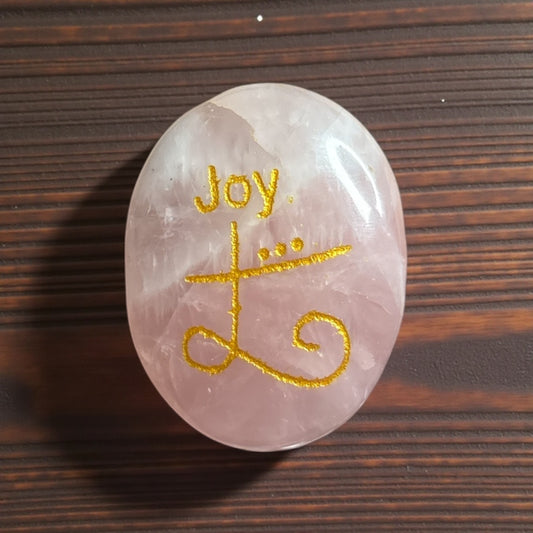 Zibu Symbol Palm Stone – Joy Symbol Engraved on Rose Quartz